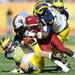 Michigan linebacker Desmond Morgan and defensive tackle Quinton Washington bring down South Carolina tailback Shon Carson in the second quarter of the Outback Bowl at Raymond James Stadium in Tampa, Fla. on Tuesday, Jan. 1. Melanie Maxwell I AnnArbor.com